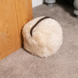 Luxurious Beige Sheepskin Door Stop from Simply Sheepskin add comfort and style to any room.