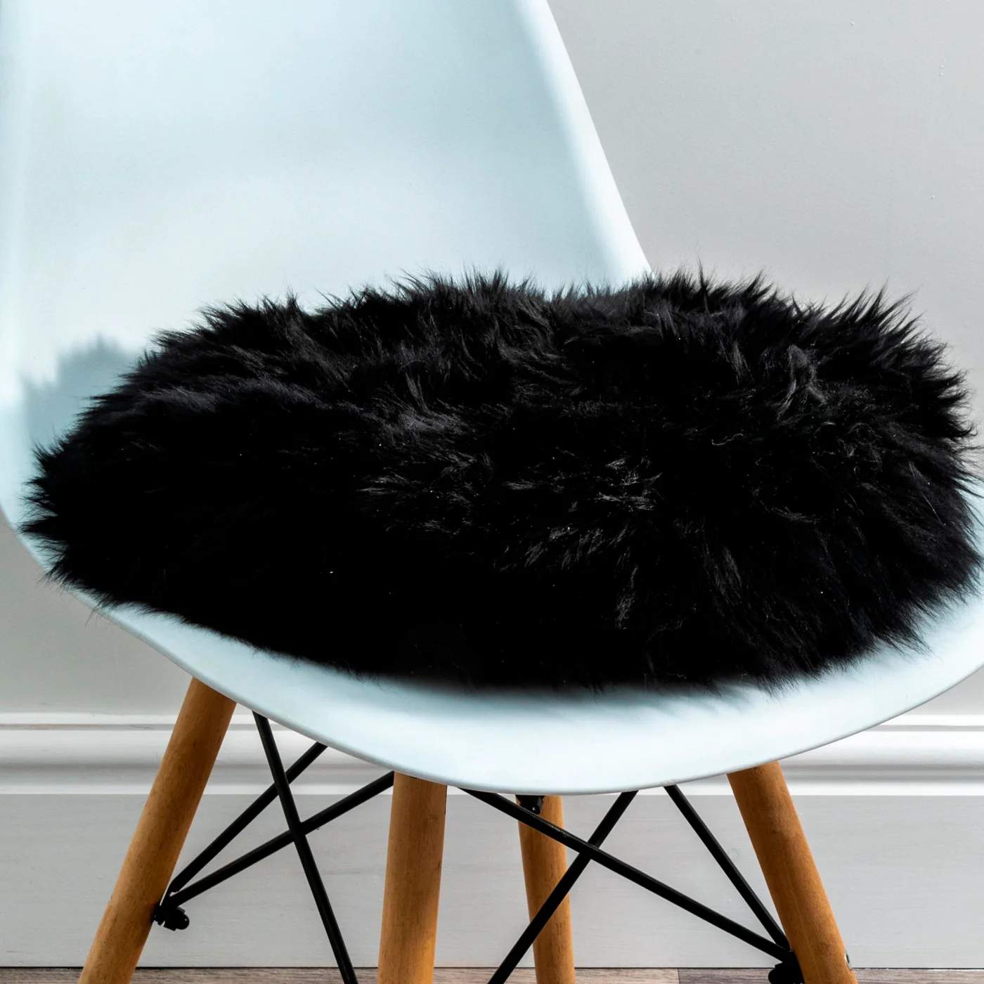 Luxurious Black Sheepskin Seat Pads from Simply Sheepskin add comfort and style to any room