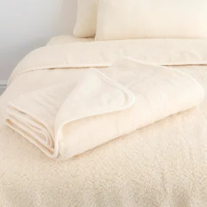 Luxurious Cream Merino Wool Blanket Medium from Simply Sheepskin add comfort and style to any room.