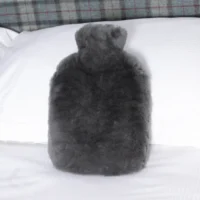 Luxurious Grey Hot Water Bottle Sheepskin from Simply Sheepskin add comfort and style to any room.