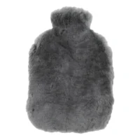 A soft, grey sheepskin hot water bottle cover with a plush, fluffy texture and rounded rectangular shape, designed to fit snugly around the Grey Sheepskin Hot Water Bottle.