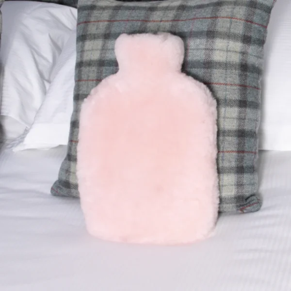 Luxurious Pink Hot Water Bottle Sheepskin from Simply Sheepskin add comfort and style to any room.