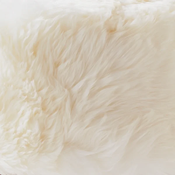 Luxurious White Sheepskin Light Wood Stool from Simply Sheepskin add comfort and style to any room.