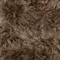 Close-up of the Taupe Sheepskin Rug - Extra Large, featuring long, wavy strands in varied brown shades. The soft, fluffy texture and dense material create a natural and cosy look that fills the entire frame.